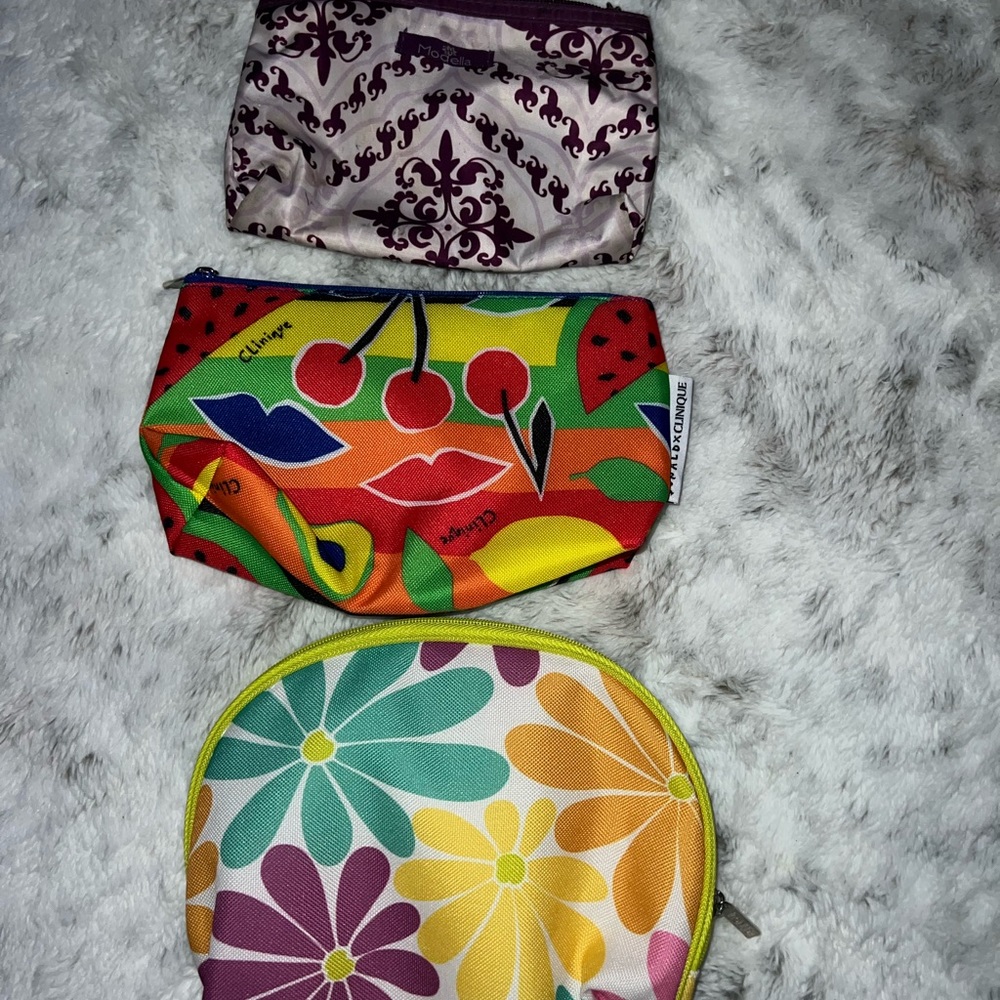 Makeup bags (2) Clinique, (1) Modella